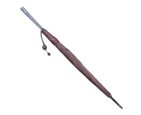 A late 19th / early 20th Century Indian white-metal handled umbrella by Oomersee Mawjee &amp; Sons, the handle profusely chas