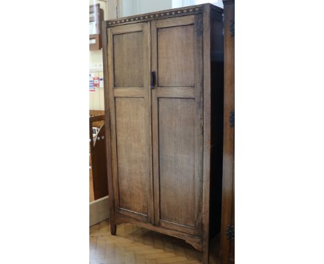 A gentleman's oak compactum-style wardrobe, circa 1940s, 172 cm x 90 cm