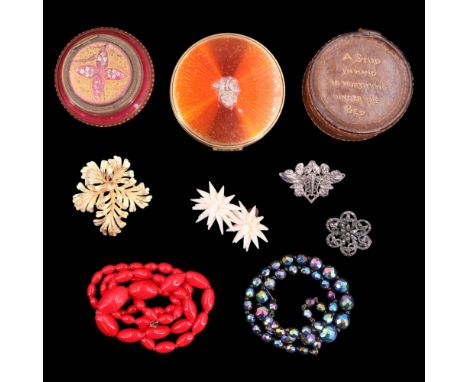 A vintage leather studs box containing cufflinks and shirt studs, costume jewellery brooches, earrings and necklaces, a powde