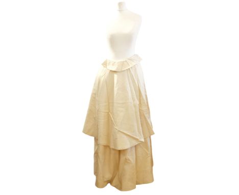 A 1920s / 1930s ivory embroidered cotton cape with satin ribbon ties and tassels 