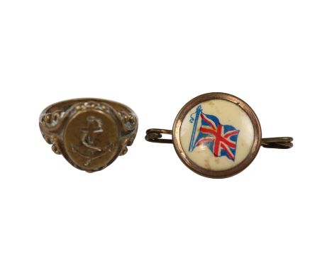 A gilt metal Royal Navy signet ring, its oval matrix bearing an intaglio fouled anchor, together with a brass Union Jack swee
