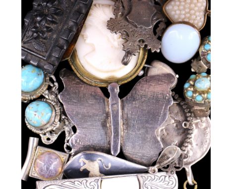 A group of early 20th Century and other jewellery, including a faux jet floral tablet brooch, a vintage niello lion white met