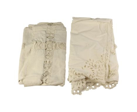 An early 20th Century whitework linen tablecloth with openwork detailing together with a similar later example