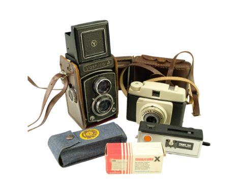 A cased Yashica-A Twin Lens Reflex medium format (120 mm) film camera together with Prinz 110 Sharpshooter pocket and Ilford 