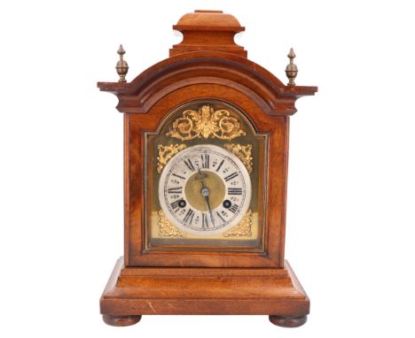 A late 19th / early 20th Century  walnut bracket clock by Junghans, having a two-train movement with silvered chapter ring, g