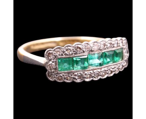 An impressive Art Deco-influenced emerald and diamond ring, comprising a band of five princess-cut emeralds set within a cusp
