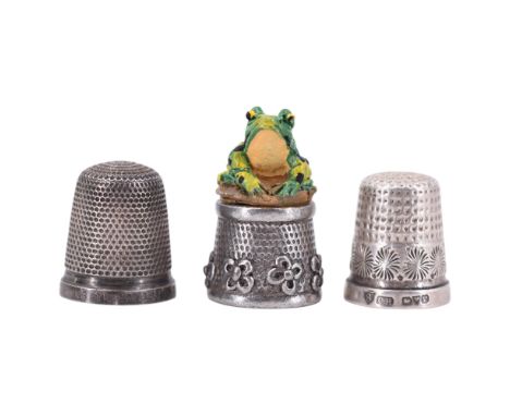 A 1920s Charles Horner silver thimble together with a Sterling standard white metal "The Spa" and one other thimble