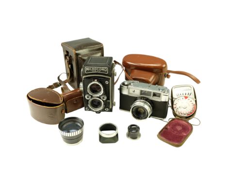 A 1950s Microcord Twin Lens Reflex medium format (120 mm) film camera, cased, together with a Yashica J 35 mm film camera, We