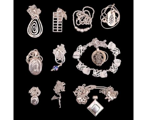 A group of contemporary white metal necklaces, including Charles rennie Mackintosh influenced, Greek theatre mask and flower 