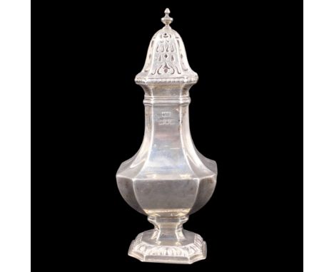 A George V silver caster, of square baluster form bearing an engraved armorial crest, London, Mappin &amp; Webb, 1913, 21 cm,