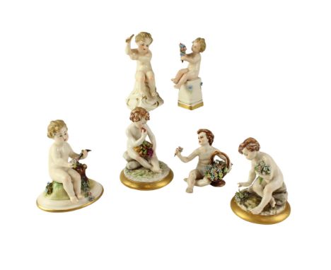 A group of six Capodimonte porcelain putti, tallest 12 cm