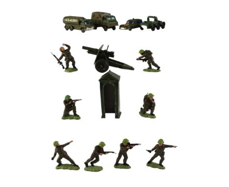 A group of vintage diecast toy military vehicles together with a group of plastic toy soldiers, including a Lesney Saladin ar