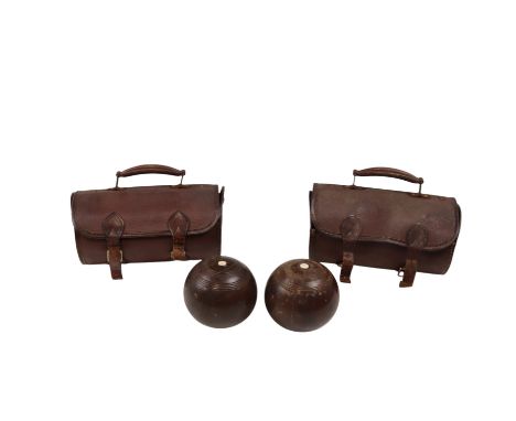 Four Taylor Rolph Co Ltd of London "Kings" lawn bowls, sizes 1 to 4, together with two other similar lignum vitae woods, with