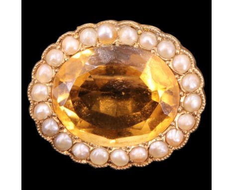 A late 19th / early 20th Century citrine, pearl and 15 ct yellow metal brooch, the large oval-cut stone of approx 14 mm x 12 