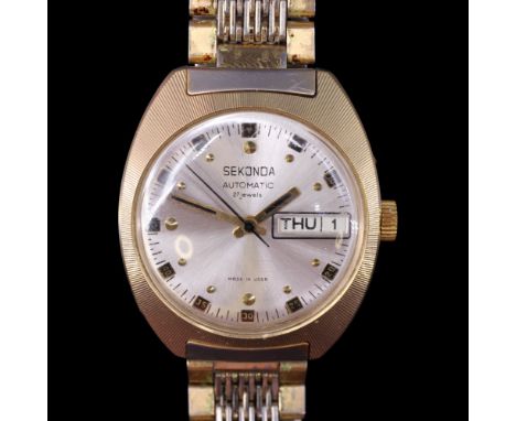 A 1960s-1970s Soviet Russian Sekonda day-date wristwatch, having a 27-jewel automatic movement and radially-brushed silver fa