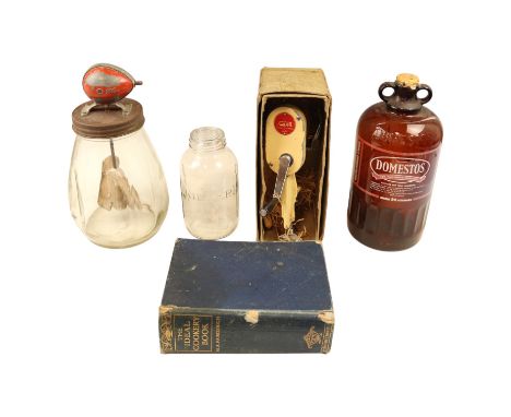 Kitchenalia including a Blow butter churn, a Kilner jar, a Domestos demijohn, a Kwikpeel peeler and the "Ideal Cookery" Fairc