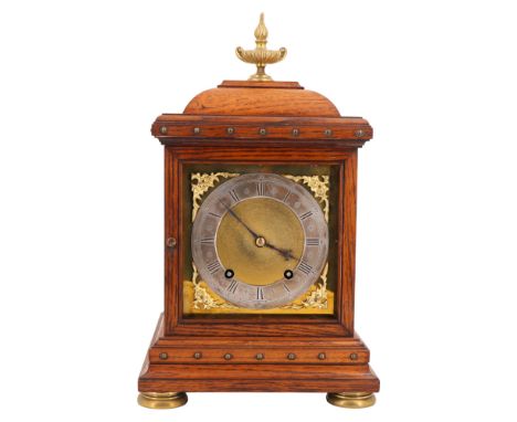 A Victorian brass-mounted oak bracket clock by Winterhalder &amp; Hofmeier, having a two-train movement with square face and 