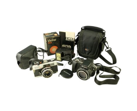 Vintage Ricoh 500 GX 35 mm and Olympus SP-560UZ digital cameras together with a Vivitar 255 auto electronic flash