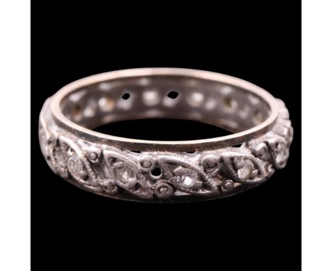 A vintage white stone and white and yellow metal eternity ring, K/L, 2.3 g 