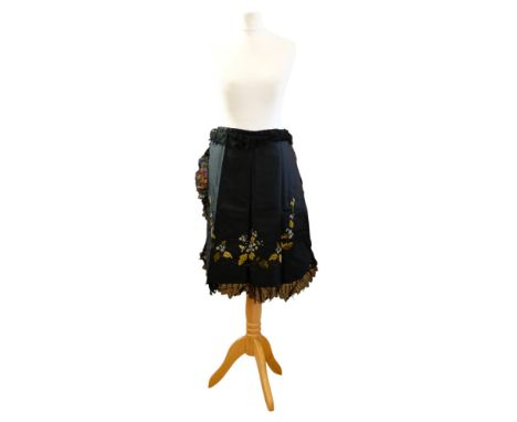 A late Victorian floral embroidered black waist apron, having a delicate hand-stitched lace trim