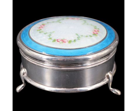 A George V silver trinket box, of drum form, its slightly domed and hinged lid having a rose engine turned and basse-taille e