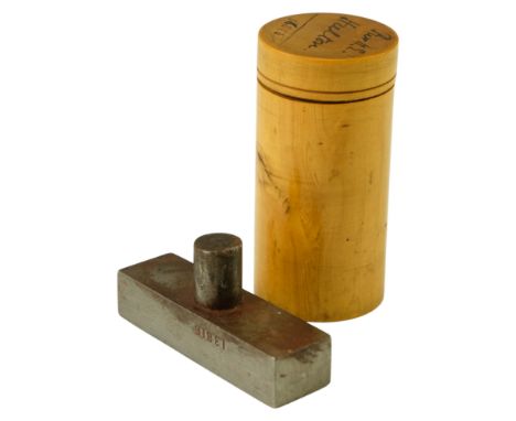 A Victorian turned boxwood cylindrical box inscribed "Rev H E Hulton" and containing a steel stamp with engraved intaglio add