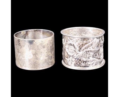 An Edwardian silver naturalistic napkin ring, relief decorated with a perched bird and butterfly amongst wild rose on a hamme
