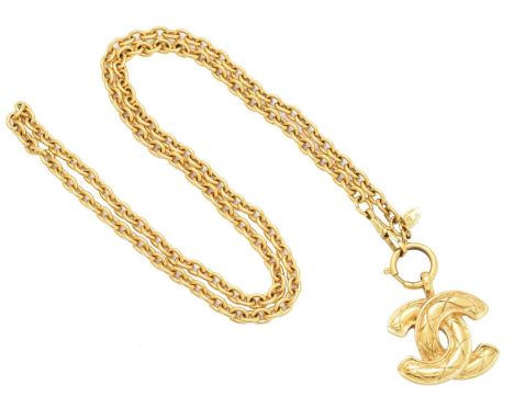 A Chanel pendant necklace, the gold-tone maker's quilted monogram suspended from a trace link chain, signed Chanel.Length of 