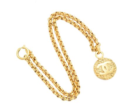 A Chanel pendant necklace, the gold tone woven detail pendant with polished maker's monogram, suspended from a trace link cha