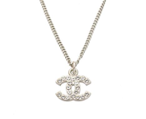 A Chanel pendant necklace, the colourless paste maker's monogram, suspended from a flat curb link chain, signed and numbered 