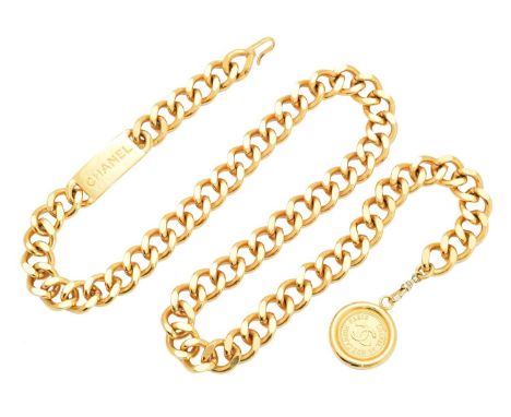 A Chanel Rue Cambon belt necklace, the gold-tone curb link chain with polished plaque accent, suspending a circular medallion