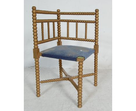 A vintage 20th century Georgian style gilt bobbin chair having shaped arm rests raised on turned legs. 69 x 38 x 38cm.&nbsp;