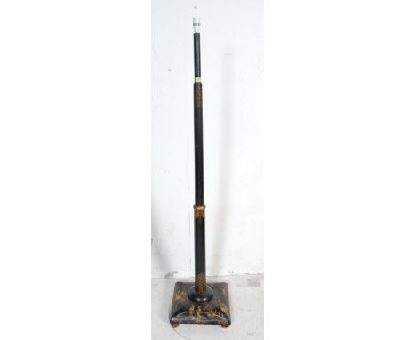 An vintage 20th century Chinese oriental chinoiserie black lacquer floor standing lamp. The lamp having turned column decorat