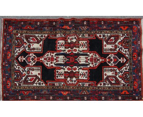 A 20th century antique Persian Islamic Hamadan handwoven wool carpet rug with large diamond to the centre multicolour foliate