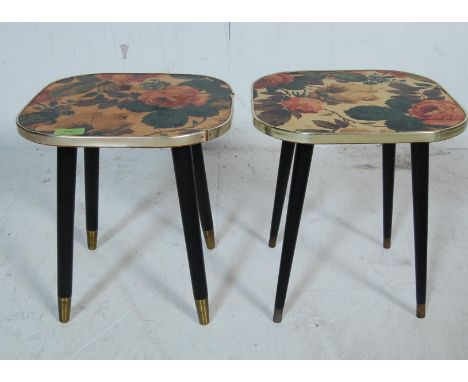 A pair of vintage retro 20th century circa 1950’s side tables. The tables having square tops decorated with floral motifs rai