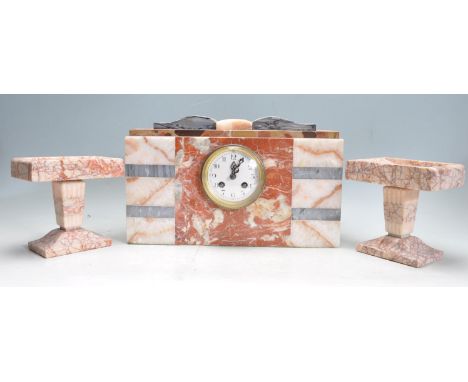 An early 20th century specimen marble mantel clock having a white enamel clock face with roman numerals to the chapter ring. 