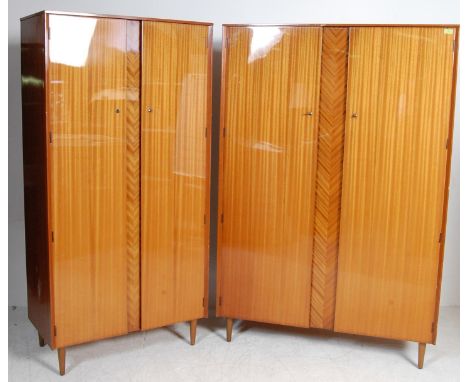 Lebus - British Modern Design - Two retro vintage mid 20th century satinwood wardrobes having a flared top over double doors 