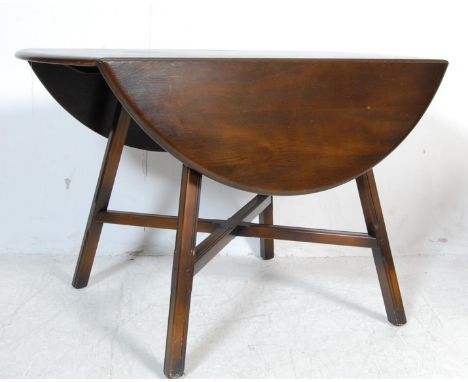 Ercol - Lucien Ercolani - Model 377. A retro vintage late 20th century beech and elm drop leaf dining table having chamfered 