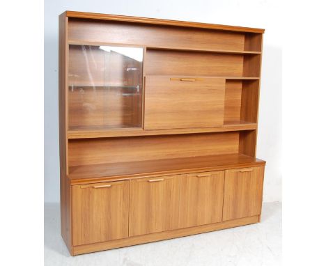 A retro vintage late 20th century teak wood wall cabinet / modular unit / dresser having a single shelf to the top with glaze