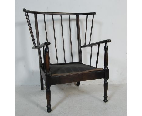 A vintage retro 20th century ebonised wooden Ercol Style / Danish inspired armchair / easy chair. The wingback chair having c