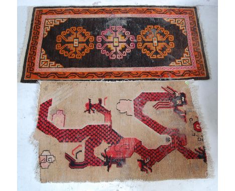 Two vintage 20th century Tibetan Oriental hand woven rugs comprising of a light brown rug with a polychrome stylised dragon t