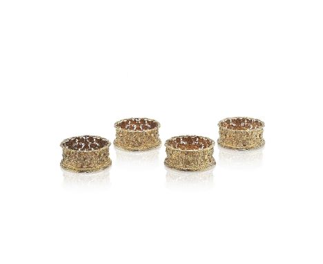 A set of four William IV silver-gilt wine coastersHenry Wilkinson & Co, Sheffield 1833 Of compressed spherical form, the whol