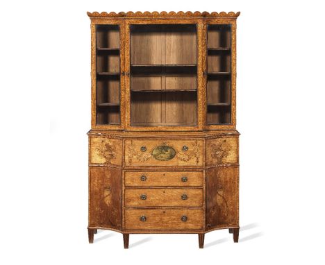 A George III satinwood, tulipwood crossbanded, purplewood and fruitwood marquetry breakfront secretaire bookcaseCirca 1785Wit