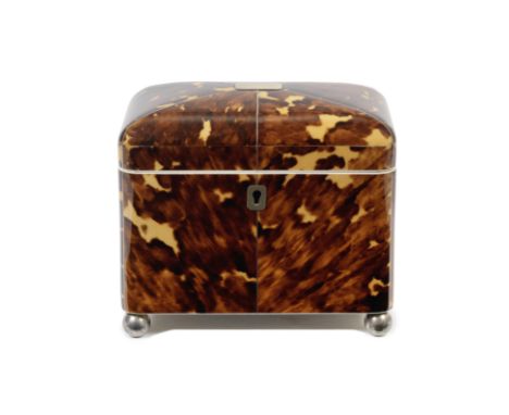 An early 19th century tortoiseshell tea caddy Of domed rectangular form with white metal and ivory stringing, the panelled ro