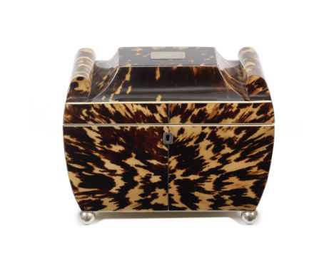 An early 19th century tortoiseshell tea caddy Of unusual scroll ended sarcophagus rectangular with white metal and ivory stri