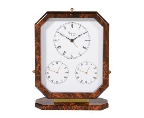  Asprey, a gilt metal and brown lacquer triple time zone alarm desk clock,   three quartz movements, white dials, Roman numer