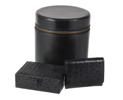  Asprey, a black ostrich stud box,   the rectangular case with a button fastening, the interior with two velvet pads, 11.6 x 
