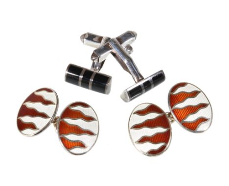  Asprey, a pair of silver and enamel double sided cufflinks,   London 1995,  the red and white guilloche enamel oval panels w