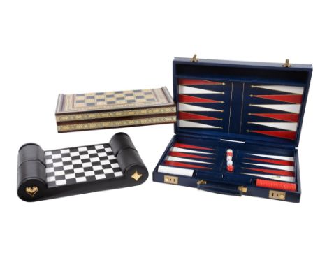 Ω Asprey, a blue leather attache case, with two key lock clasps, opening to a backgammon board, a set of counters, two dice s