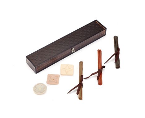  Louis Vuitton, an incense burner travel set,   with three ceramic stands and three bundles of incense sticks, in a rectangul